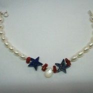 Bracciale con perle, stella lapis, corallo e goccia madreperla